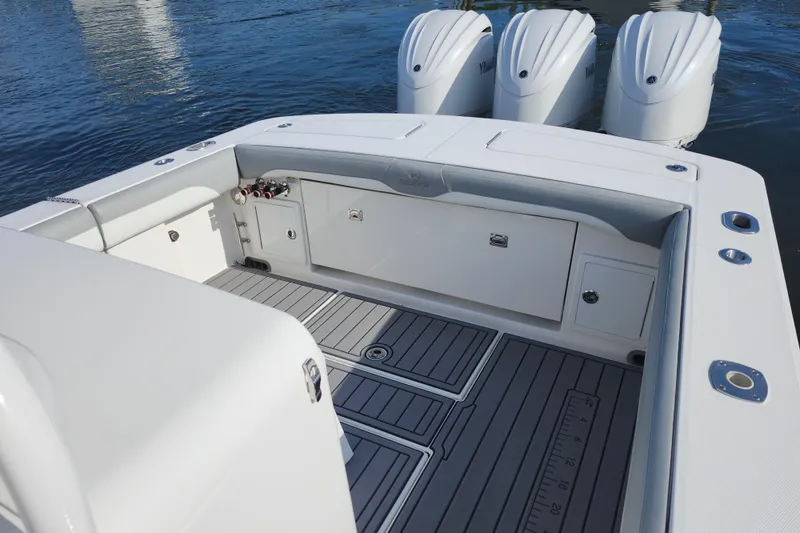 Slide: The Image of 2022 Regulator 34 boat deck with triple engines and spacious seating area. - 27