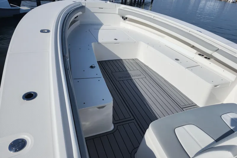 Slide: The Image of 2022 Regulator 34 boat interior with spacious seating and sleek design. - 31