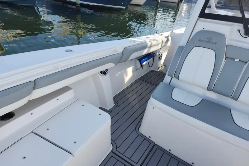 Slide: The Image of 2022 Regulator 34 boat interior with sleek seating and modern design. - 34