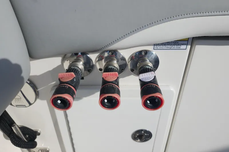 Slide: The Image of Boat control panel with three valves on a 2022 Regulator 34 model. - 38