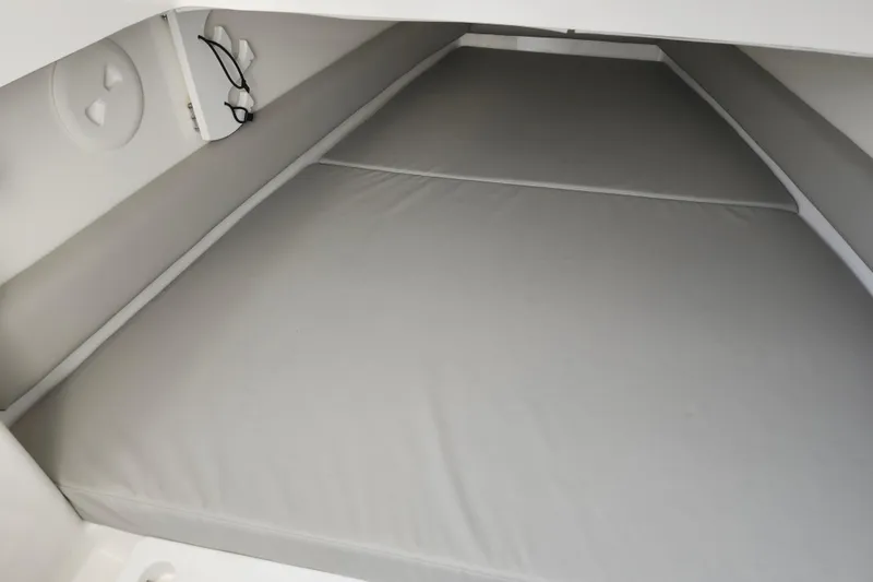 Slide: The Image of 2022 Regulator 34 boat cabin interior with cushioned sleeping area. - 41