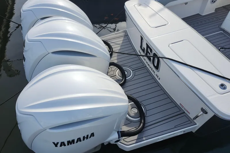 Slide: The Image of 2022 Regulator 34 boat with triple Yamaha outboard engines, docked in Beach Haven, NJ. - 48
