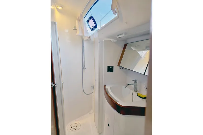 Slide: The Image of Beneteau 40 yacht bathroom interior, featuring a shower and sink, 2011 model. - 17