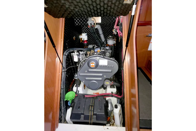Slide: The Image of Engine compartment of a 2011 Beneteau 40 sailboat, featuring a Yanmar engine. - 18