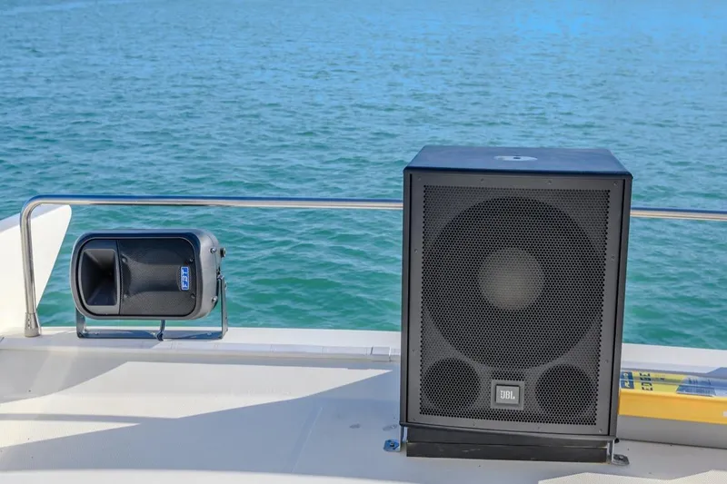 Slide: The Image of Speakers on Azimut FLY 55 yacht deck, 2006 model, with ocean backdrop. - 13