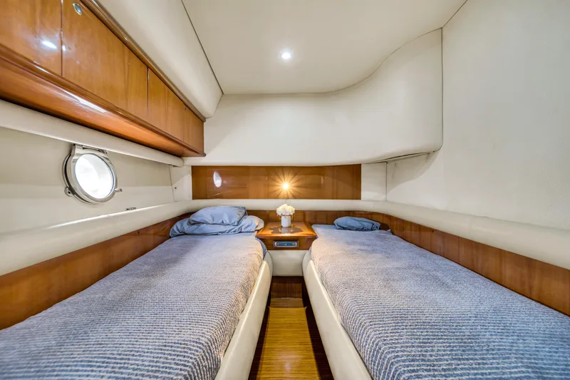 Slide: The Image of Luxurious twin cabin interior of 2006 Azimut FLY 55 yacht with elegant wood finish. - 3