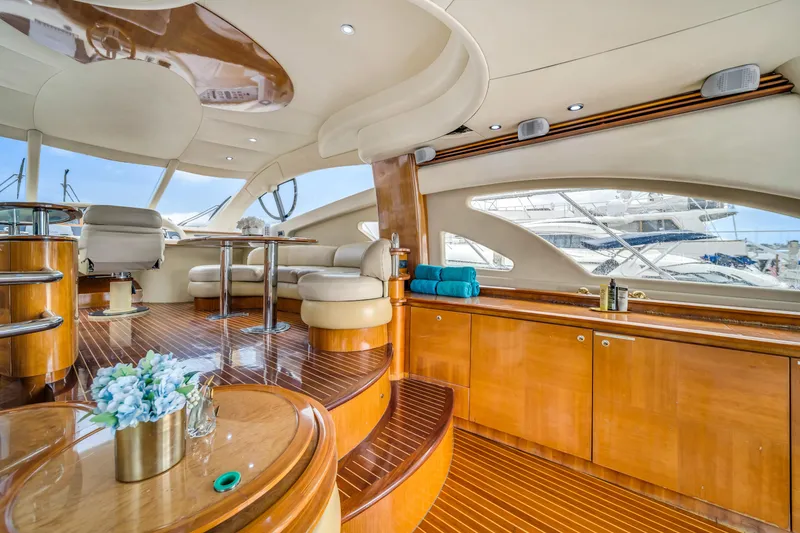 Slide: The Image of Luxurious interior of 2006 Azimut FLY 55 yacht with elegant wood finishes and seating. - 6