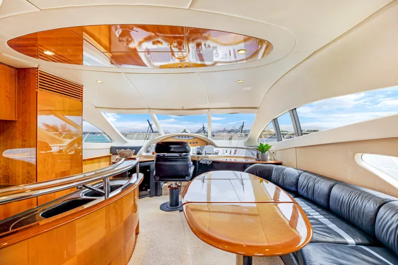 Slide: The Image of Luxurious interior of a 2004 Azimut 62 yacht with modern furnishings and panoramic windows. - 10