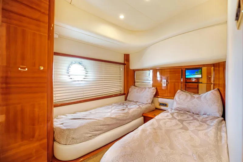 Slide: The Image of Luxurious twin cabin interior of 2004 Azimut 62 yacht with wooden finishes. - 21
