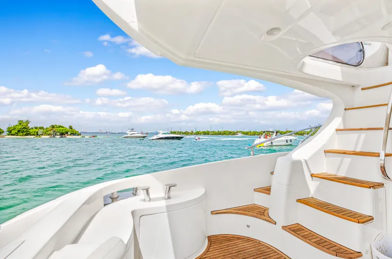Slide: The Image of View from 2004 Azimut 62 yacht, overlooking serene waters and distant boats. - 23
