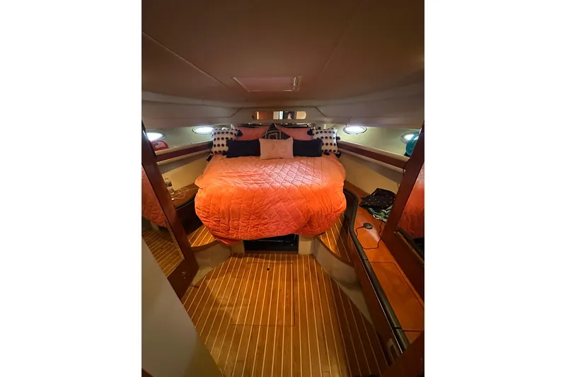 Slide: The Image of Luxurious cabin interior of 2003 Sea Ray 460 Sundancer with cozy bedding. - 10