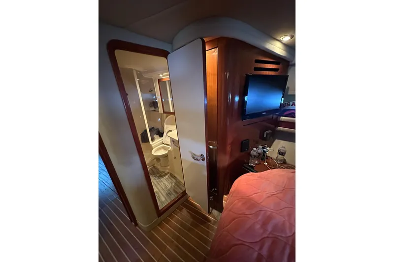 Slide: The Image of Interior of 2003 Sea Ray 460 Sundancer yacht, featuring bathroom and cabin amenities. - 11