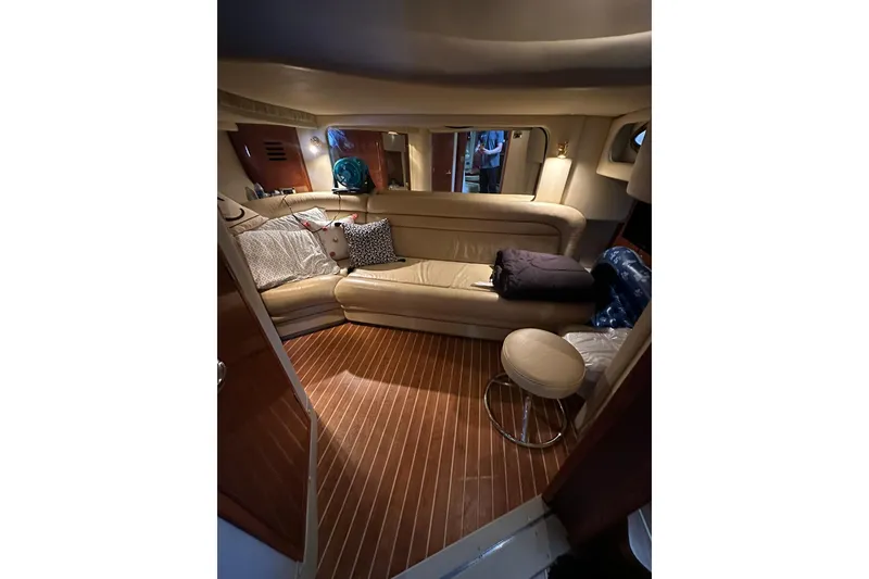 Slide: The Image of Luxurious interior of 2003 Sea Ray 460 Sundancer yacht with leather seating and wooden flooring. - 7