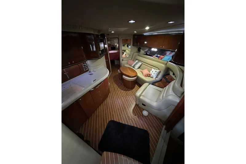 Slide: The Image of Luxurious interior of 2003 Sea Ray 460 Sundancer yacht with elegant seating and wood finishes. - 8