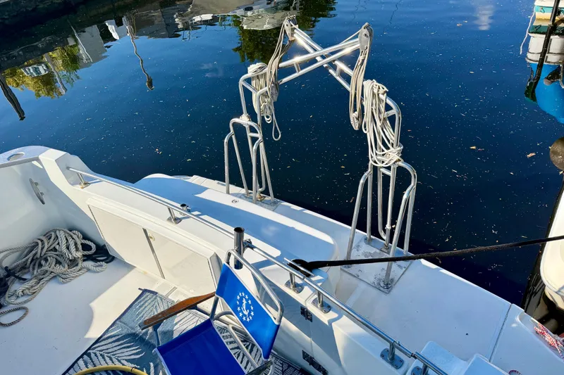 Slide: The Image of 2002 Carver 444 Cockpit Motor Yacht with ropes and blue chair on deck. - 20