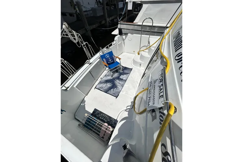 Slide: The Image of 2002 Carver 444 Cockpit Motor Yacht for sale, featuring spacious deck and seating area. - 8