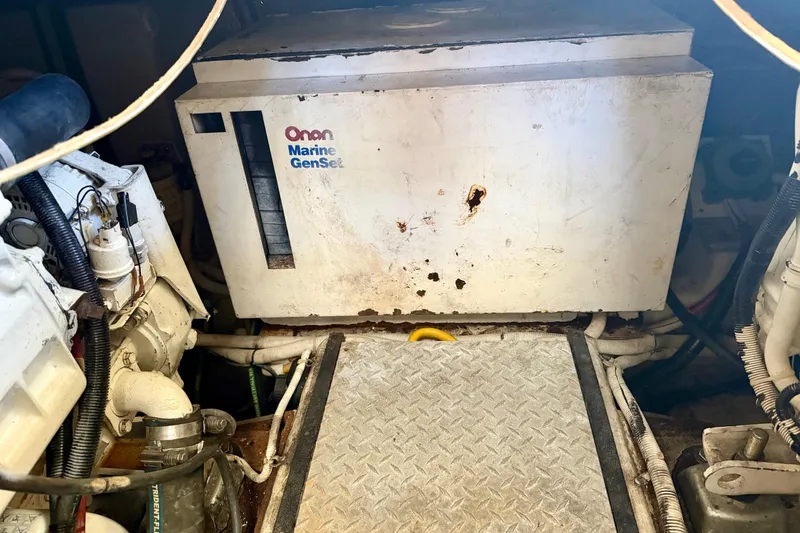 Slide: The Image of Engine room of 2002 Carver 444 Cockpit Motor Yacht with Onan Marine GenSet. - 26