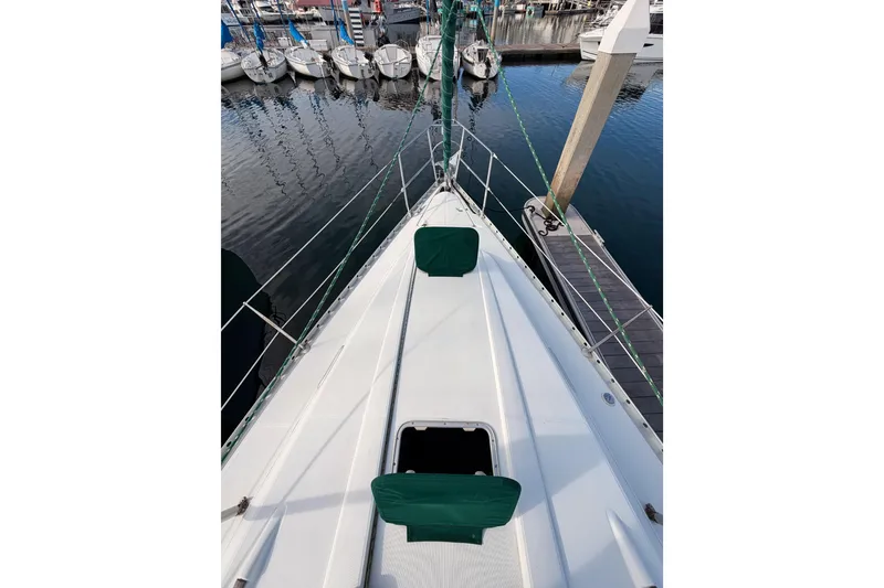 Slide: The Image of 1995 Beneteau Oceanis 351 sailboat docked at marina, view from bow. - 23