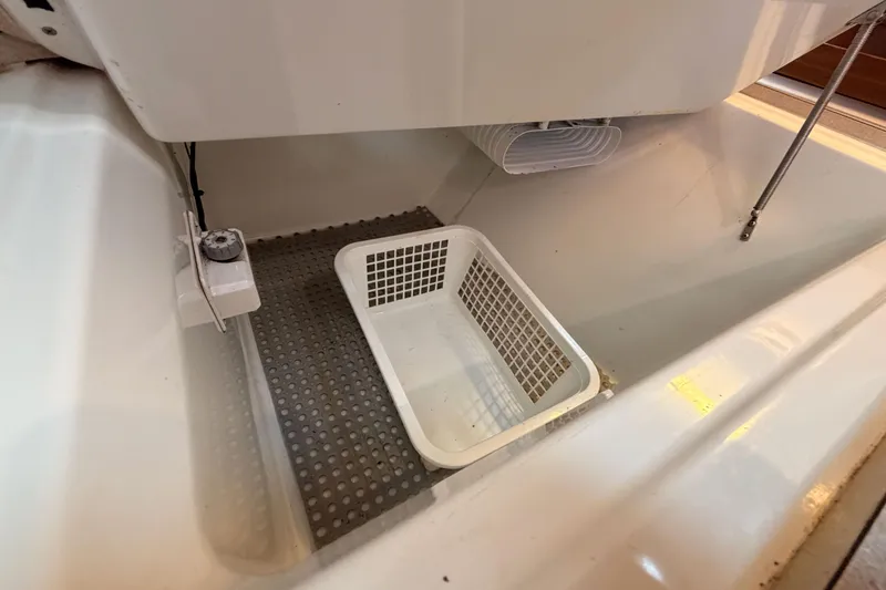 Slide: The Image of Interior view of a 1995 Beneteau Oceanis 351 sailboat storage compartment. - 37