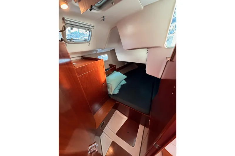 Slide: The Image of Cozy cabin interior of 1995 Beneteau Oceanis 351 sailboat with wooden furnishings. - 42