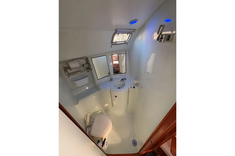 Slide: The Image of Bathroom interior of 1995 Beneteau Oceanis 351 sailboat, featuring sink and toilet. - 46