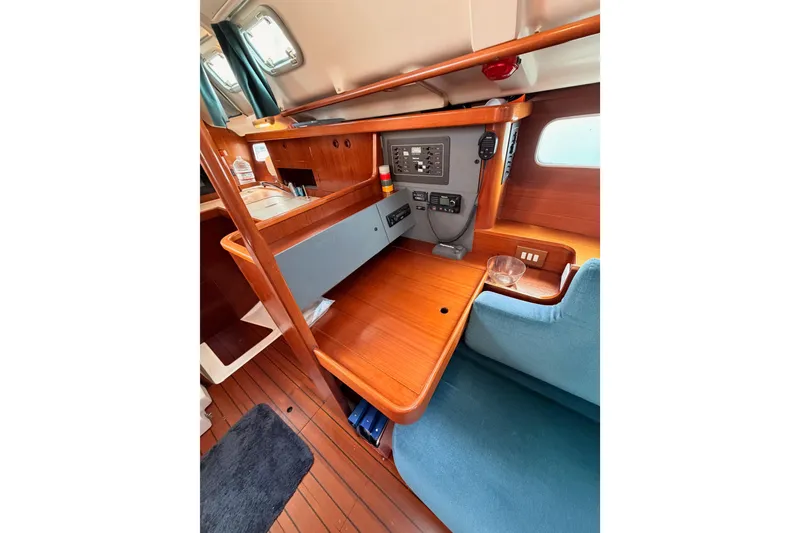 Slide: The Image of Interior of 1995 Beneteau Oceanis 351 sailboat with wooden navigation station. - 47