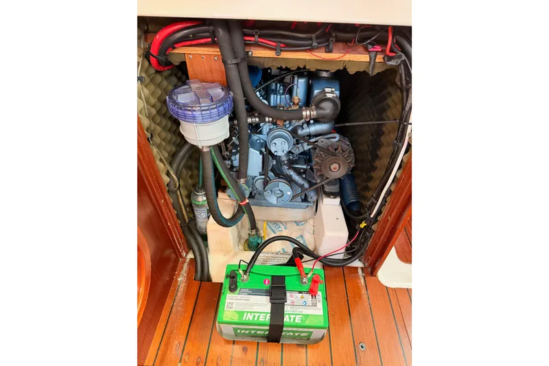 Slide: The Image of Engine compartment of a 1995 Beneteau Oceanis 351 sailboat with visible battery. - 63