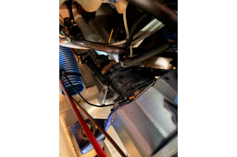 Slide: The Image of Engine compartment of a 1995 Beneteau Oceanis 351 sailboat, showing mechanical components. - 65