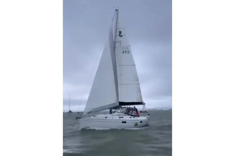 Slide: The Image of Sailing yacht Beneteau Oceanis 351, 1995 model, navigating in cloudy weather. - 70