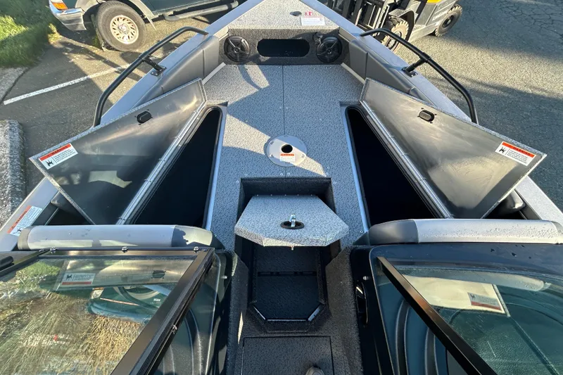 Slide: The Image of 2026 Lowe Fish & Ski 1700 boat interior with open storage compartments. - 10