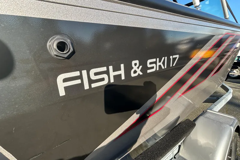 Slide: The Image of 2026 Lowe Fish & Ski 1700 boat with sleek design and graphics. - 14