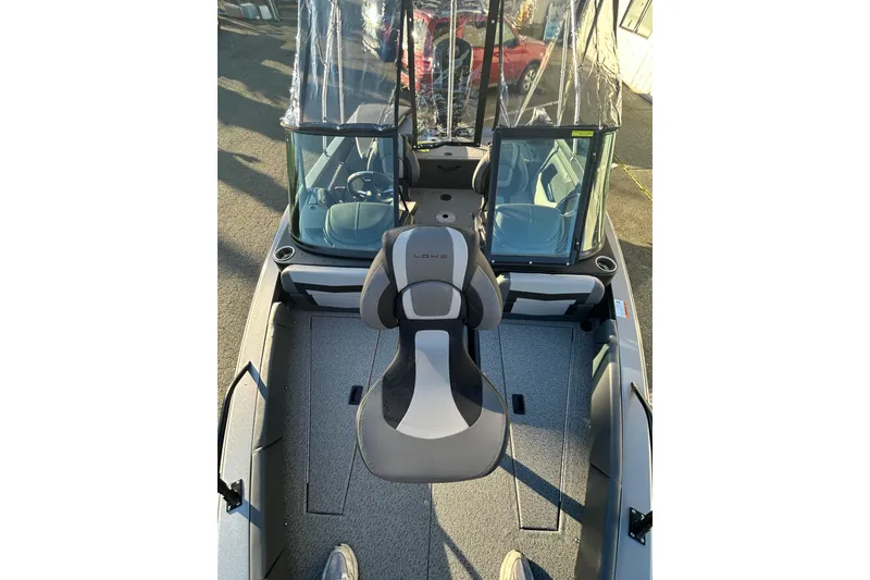 Slide: The Image of 2026 Lowe Fish & Ski 1700 boat interior with seating and windshield. - 16