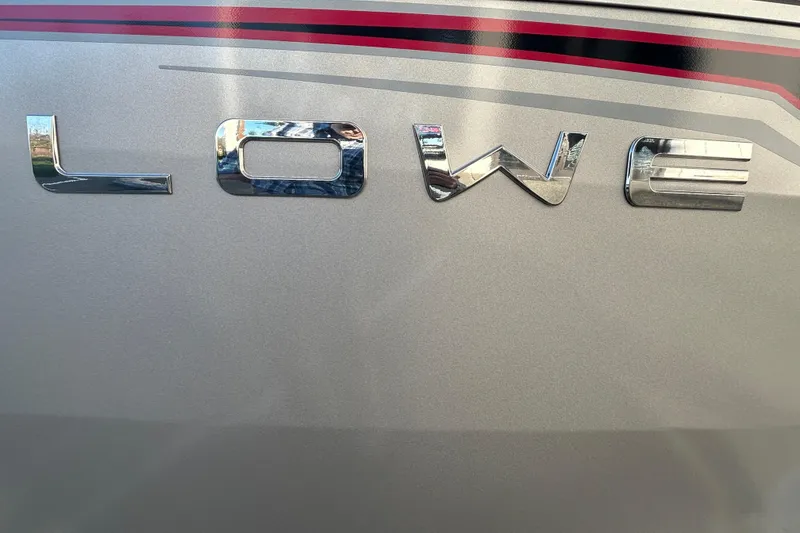 Slide: The Image of Chrome "Lowe" logo on 2026 Lowe Fish & Ski 1700 boat. - 21