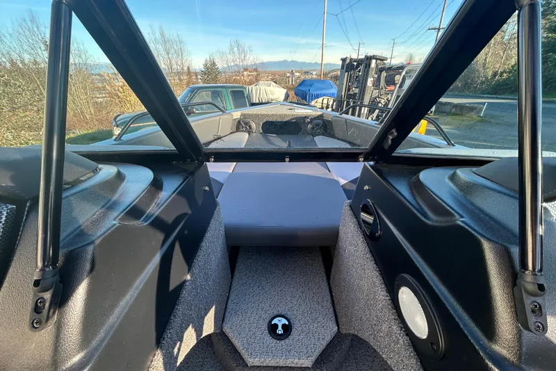 Slide: The Image of 2026 Lowe Fish & Ski 1700 boat interior with windshield and seating area. - 6