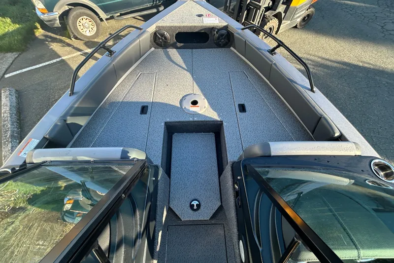 Slide: The Image of 2026 Lowe Fish & Ski 1700 boat interior with spacious deck and seating. - 8