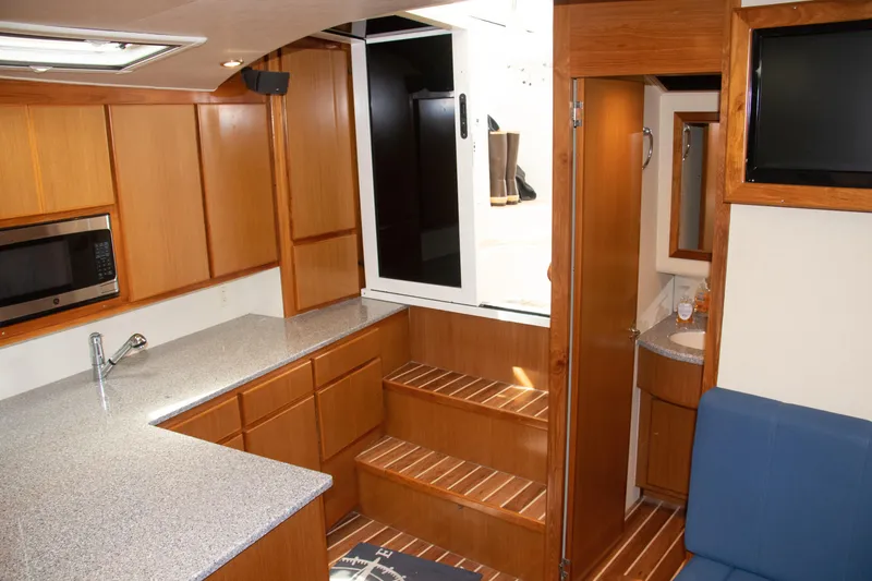 Slide: The Image of Interior of 2016 Henriques 42 Express Hardtop with kitchen and bathroom. - 23