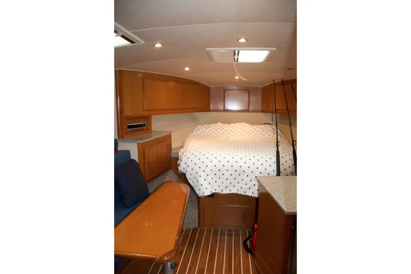 Slide: The Image of Interior of 2016 Henriques 42 Express Hardtop with cozy cabin and wooden furnishings. - 25