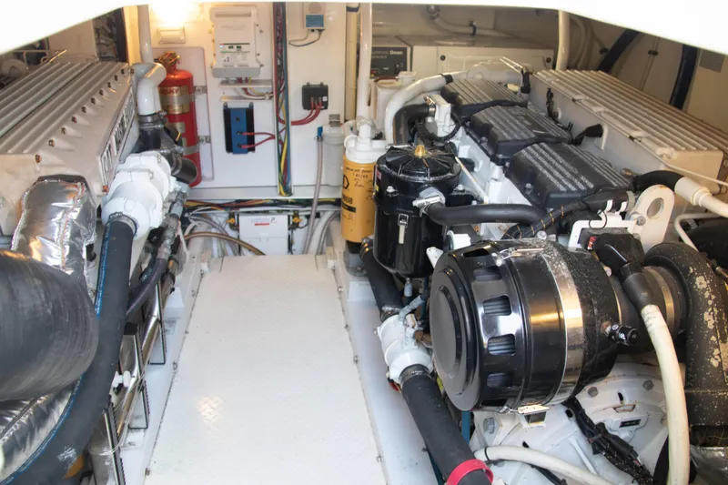 Slide: The Image of Engine room of 2016 Henriques 42 Express Hardtop, showcasing dual engines and mechanical components. - 30
