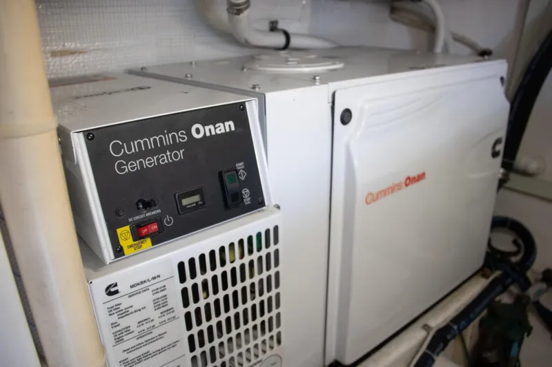 Slide: The Image of Cummins Onan generator in 2016 Henriques 42 Express Hardtop boat engine room. - 31