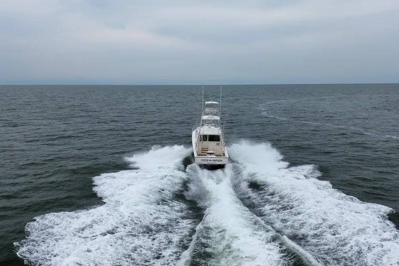 Slide: The Image of 2016 Henriques 42 Express Hardtop cruising on open sea, leaving a wake behind. - 4
