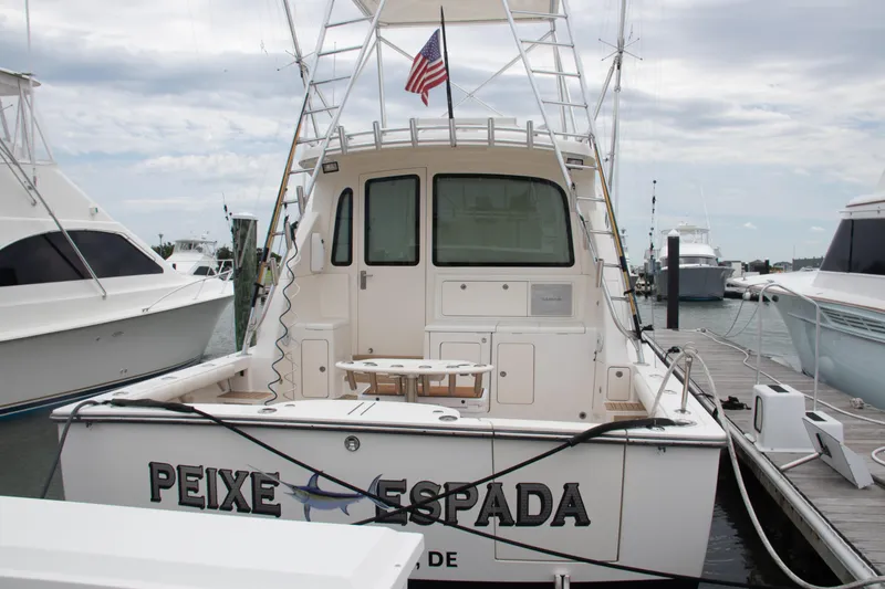 Slide: The Image of 2016 Henriques 42 Express Hardtop docked, rear view with American flag. - 9
