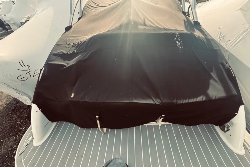 Slide: The Image of 2019 Formula 310 FX Bowrider covered, docked with protective tarp. - 14