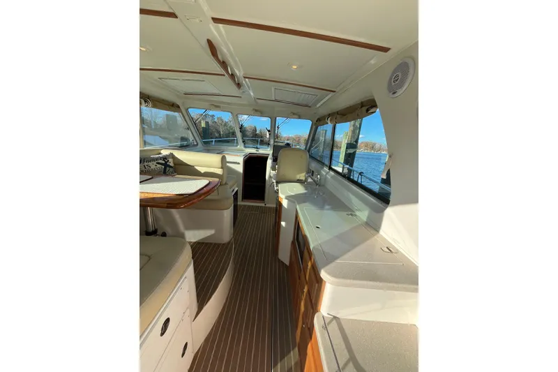Slide: The Image of Interior of 2010 Back Cove 33 Express Hardtop yacht with seating and windows. - 11