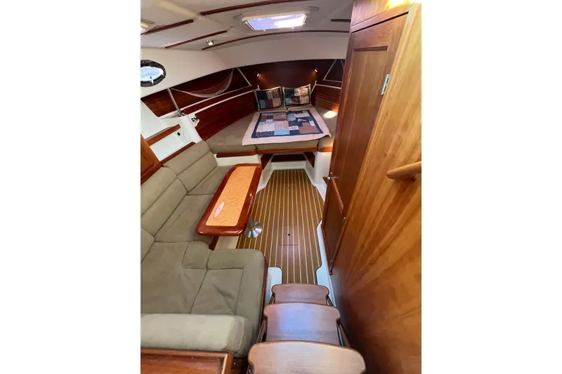 Slide: The Image of 2010 Back Cove 33 Express Hardtop interior with cozy seating and elegant wood finishes. - 19