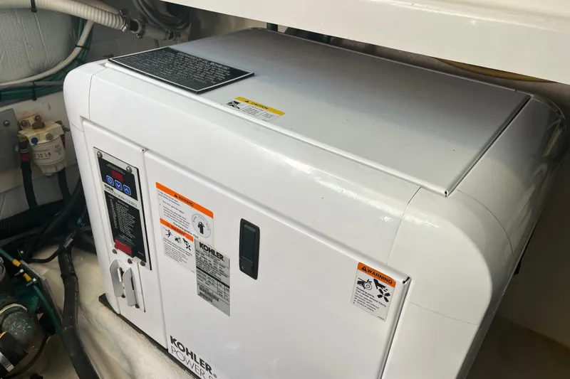 Slide: The Image of Kohler generator in 2010 Back Cove 33 Express Hardtop boat engine room. - 28