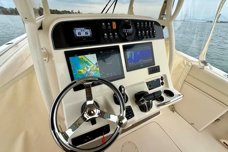 Slide: The Image of 2022 Grady-White Canyon 271 helm with advanced navigation and control systems. - 23