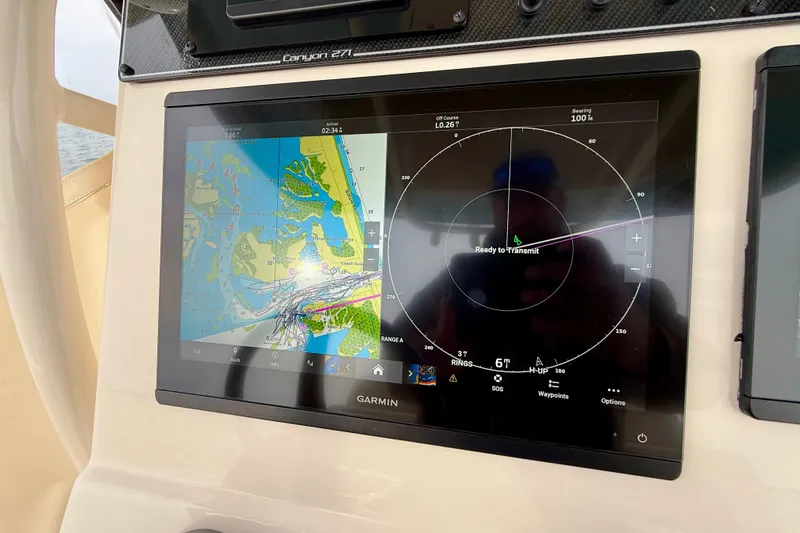 Slide: The Image of Garmin navigation display on 2022 Grady-White Canyon 271 boat dashboard. - 26