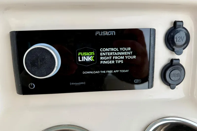 Slide: The Image of Fusion Link control panel on 2022 Grady-White Canyon 271 boat dashboard. - 27