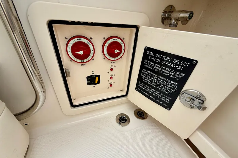 Slide: The Image of 2022 Grady-White Canyon 271 dual battery switch panel with operation instructions. - 45
