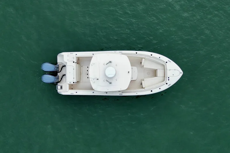 Slide: The Image of Aerial view of 2022 Grady-White Canyon 271 boat on green water. - 5